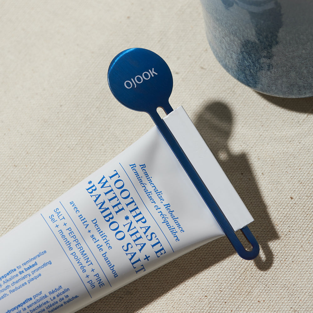 the key - a metal toothpaste squeezer